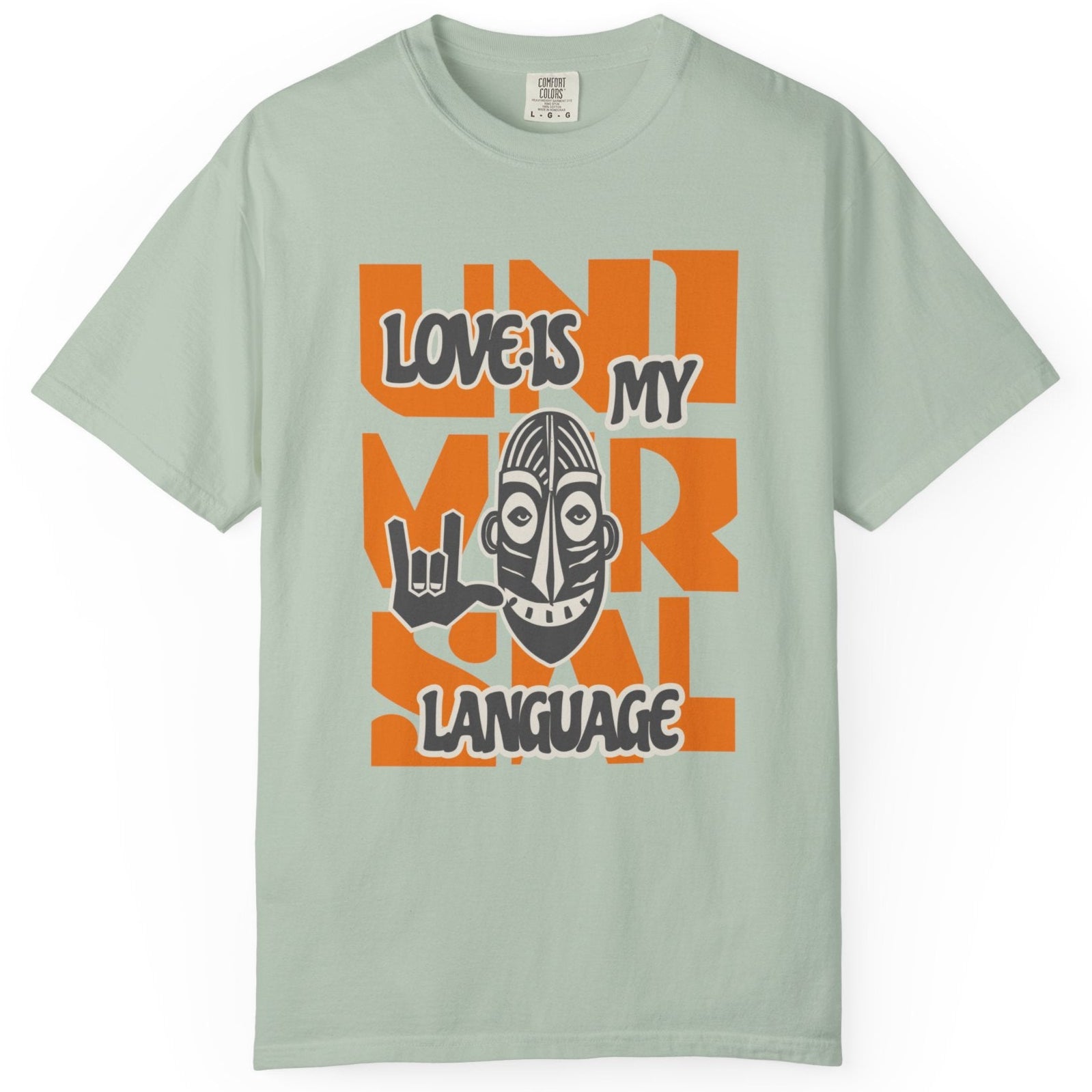 Light green t-shirt with colorful graphic design on a white background at Caribbean Rays