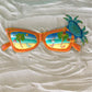 15in Orange Sunglasses with Teal Crab Wall Decor at Caribbean Rays
