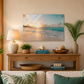 Living room with a wooden console table, lamp, and decorative items against a beach-themed wall art.