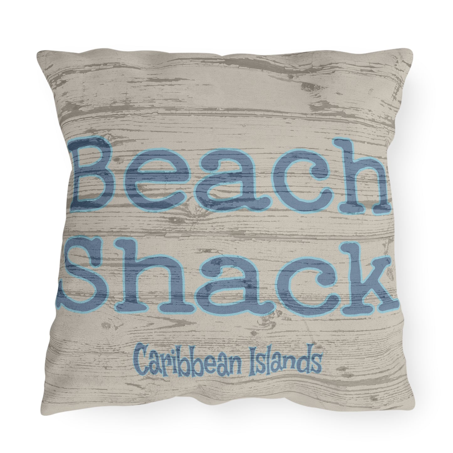 Pillow with 'Beach Shack Caribbean Islands' text on a textured background