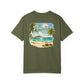 Green t-shirt with a beach scene and 'Paradise' text on a white background