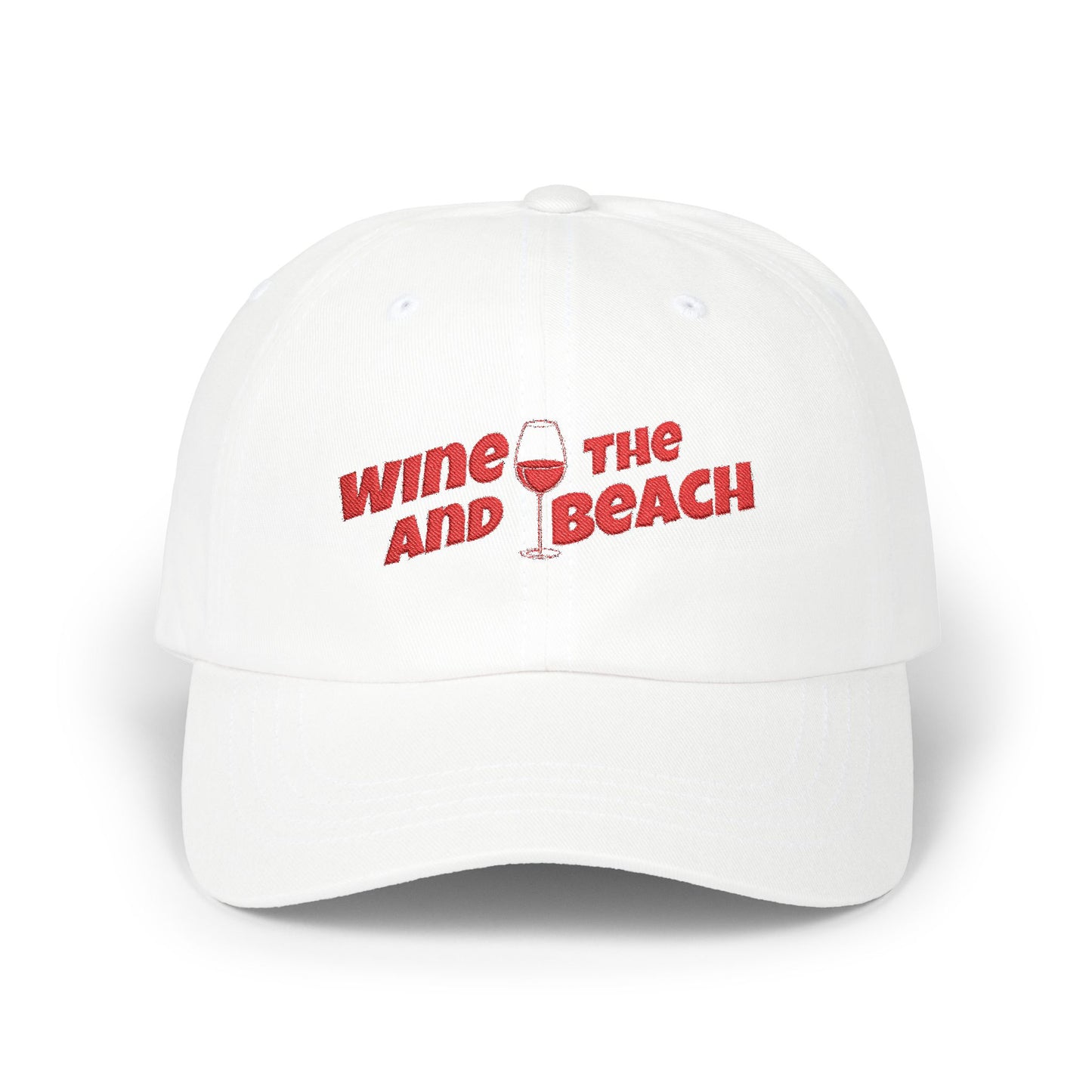 White cap with red text 'Wine and the Beach' on a white background