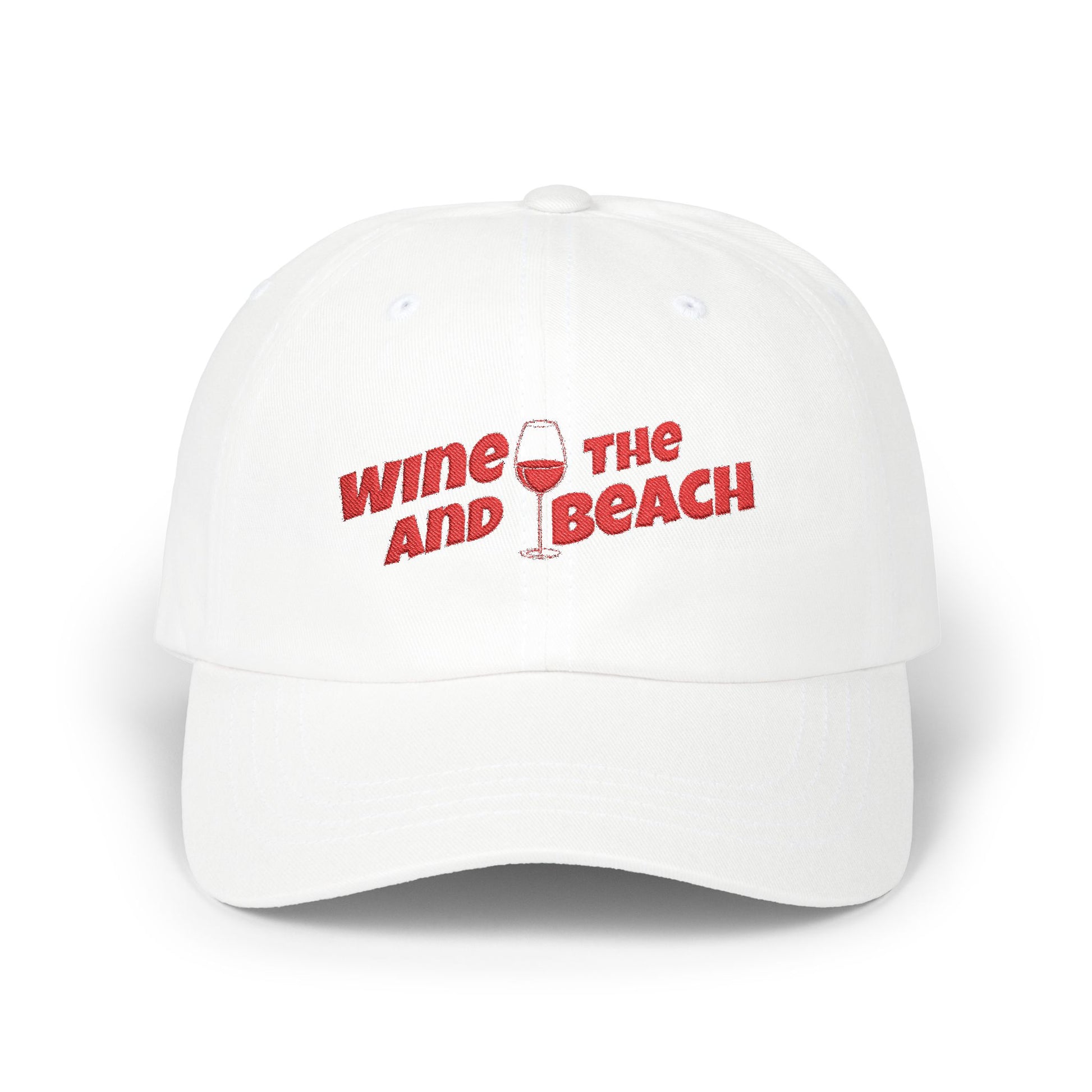 White cap with red text 'Wine and the Beach' on a white background