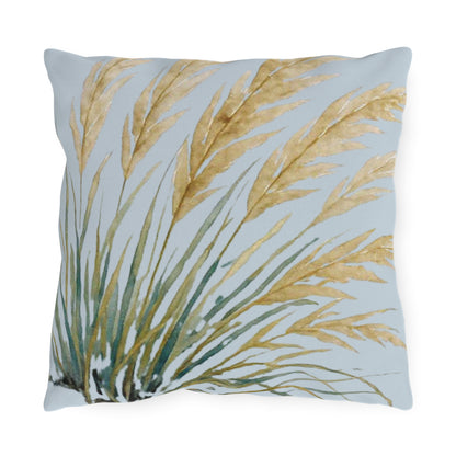 Decorative pillow with leaf pattern on a light blue background