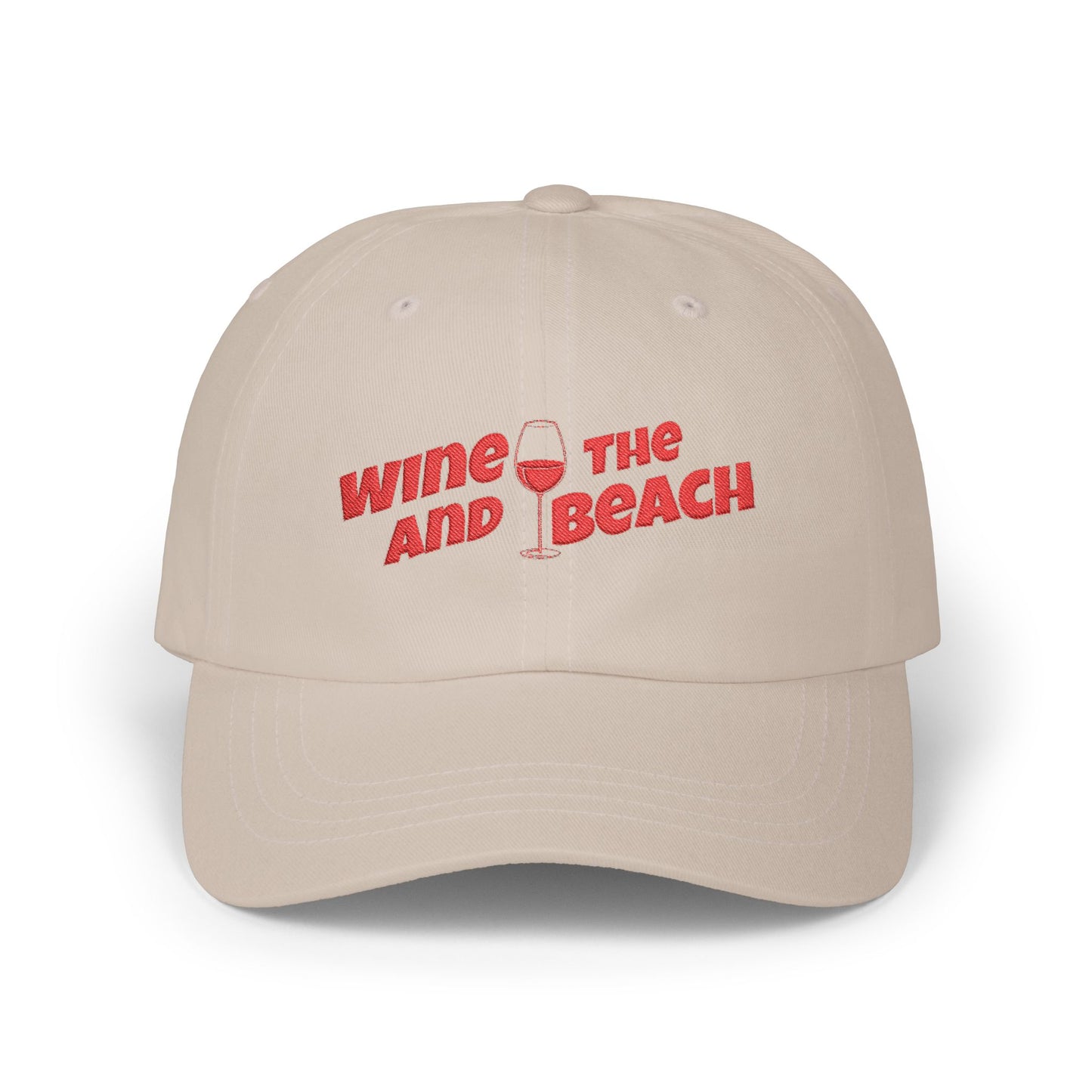 Beige cap with red text 'Wine and Beach' on a white background