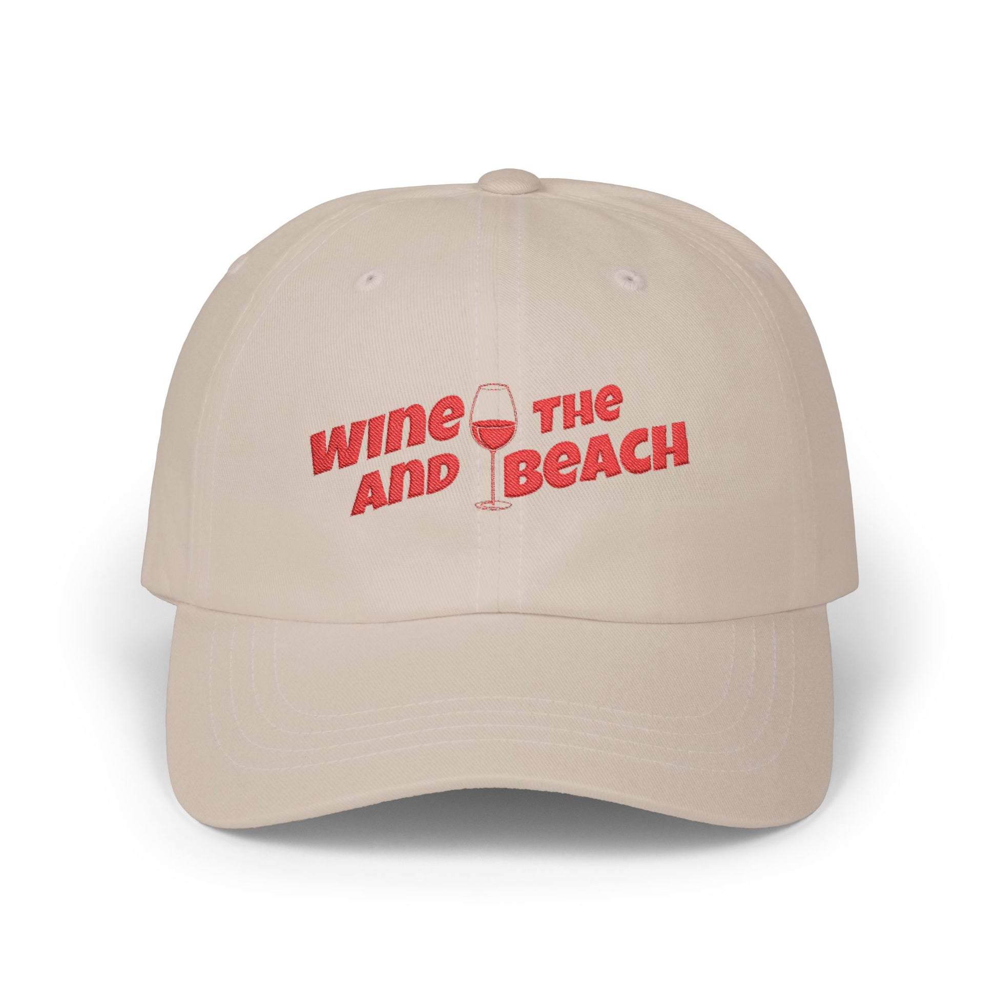 Beige cap with red text 'Wine and Beach' on a white background