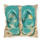 Pillow with teal flip-flops on a sandy background