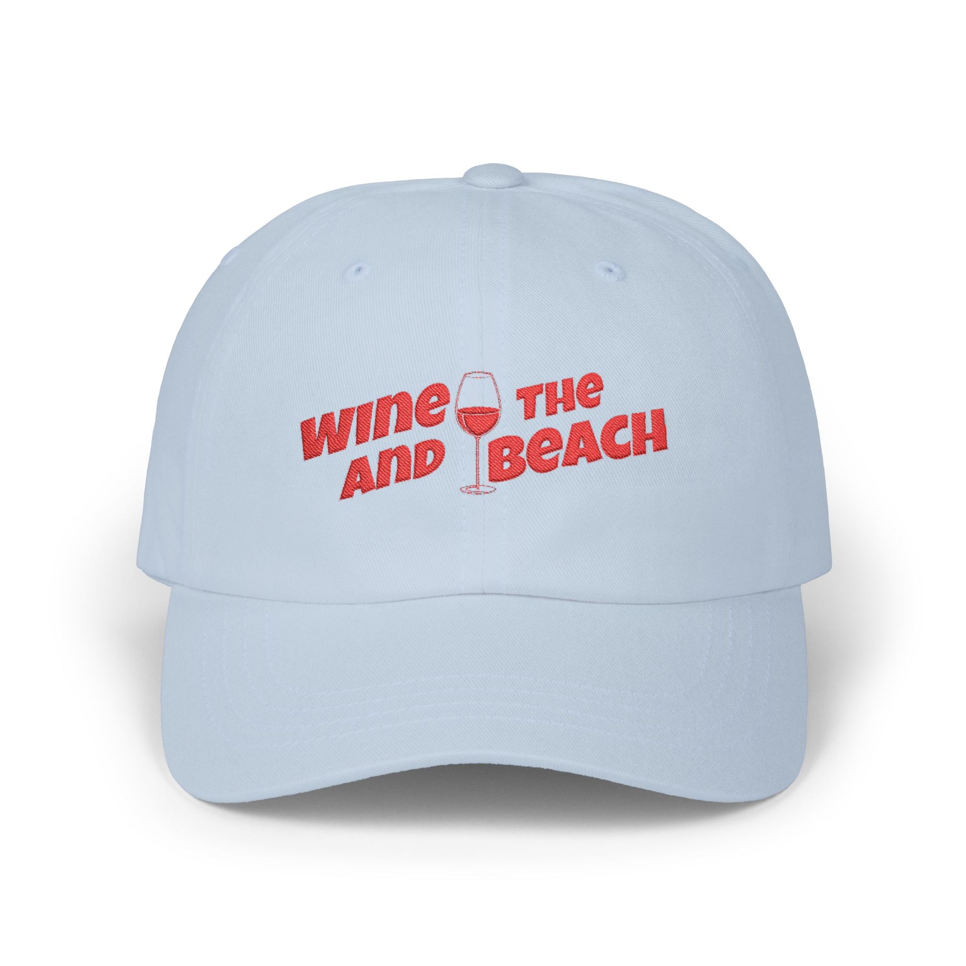 Light blue cap with red text 'Wine and Beach' on a white background