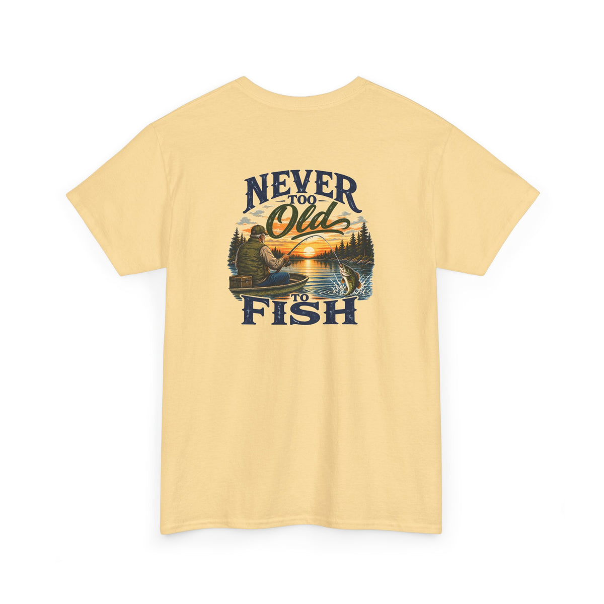 A pale yellow short-sleeve t-shirt with a vintage-style graphic on the front featuring a fisherman in a boat on a lake at sunset, framed by the text 'NEVER TOO OLD TO FISH'.