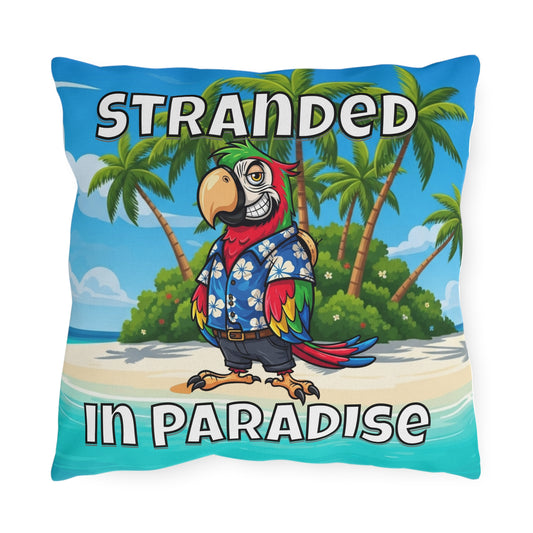 Pillow with a parrot design and 'Stranded in Paradise' text on a beach background