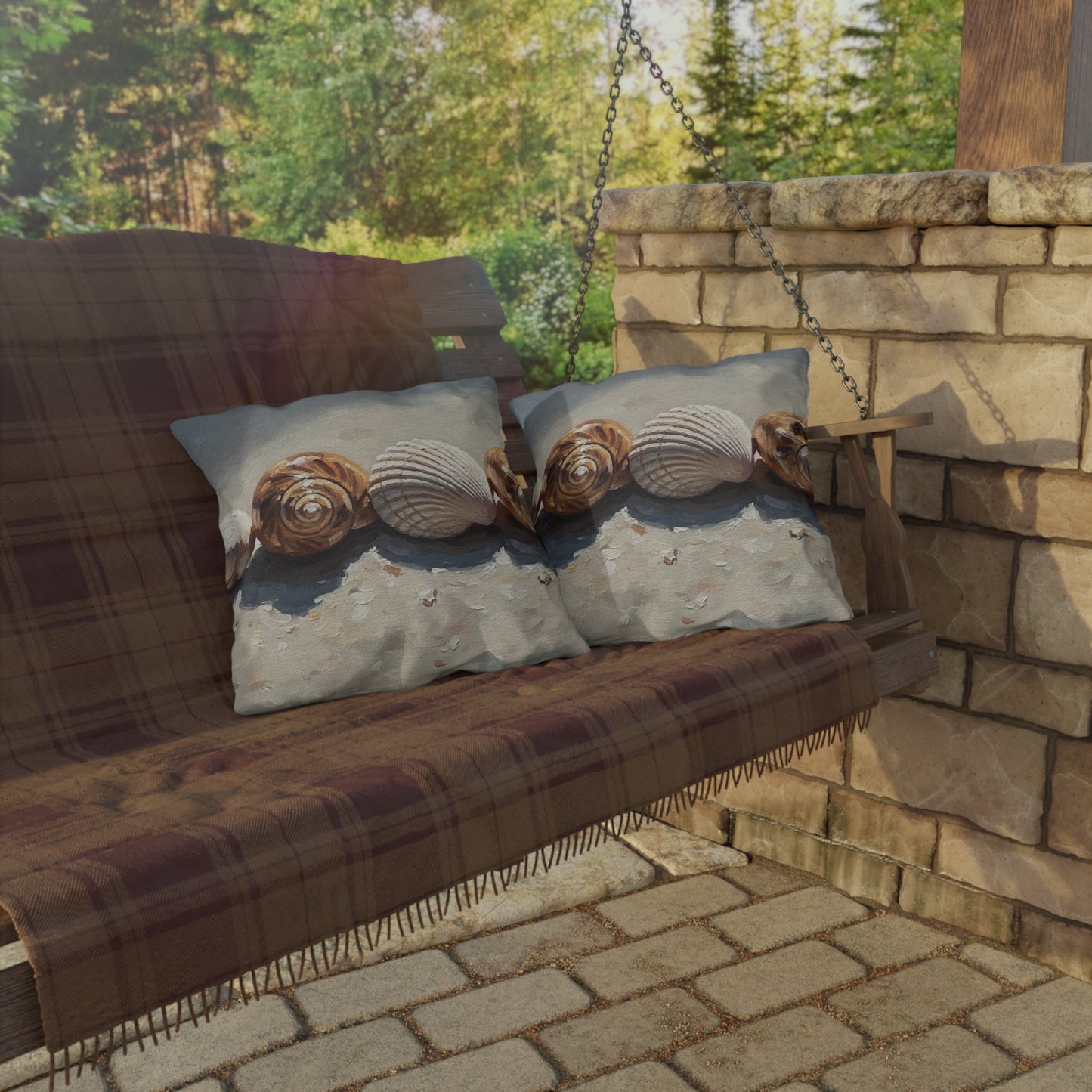 Wooden swing with plaid blanket and decorative pillows in a garden setting