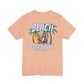 Peach t-shirt with 'Beach Paradise' graphic on a white background by Caribbean Rays