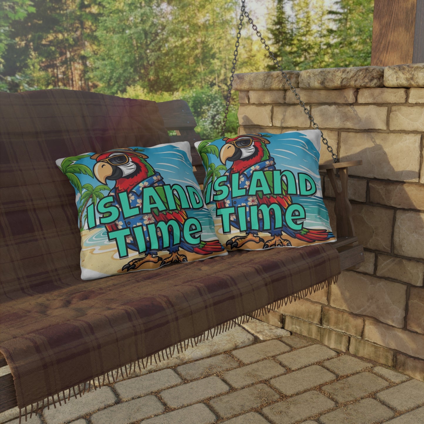 Decorative pillows with parrot design and 'Island Time' text on a swing against a stone wall and greenery background.