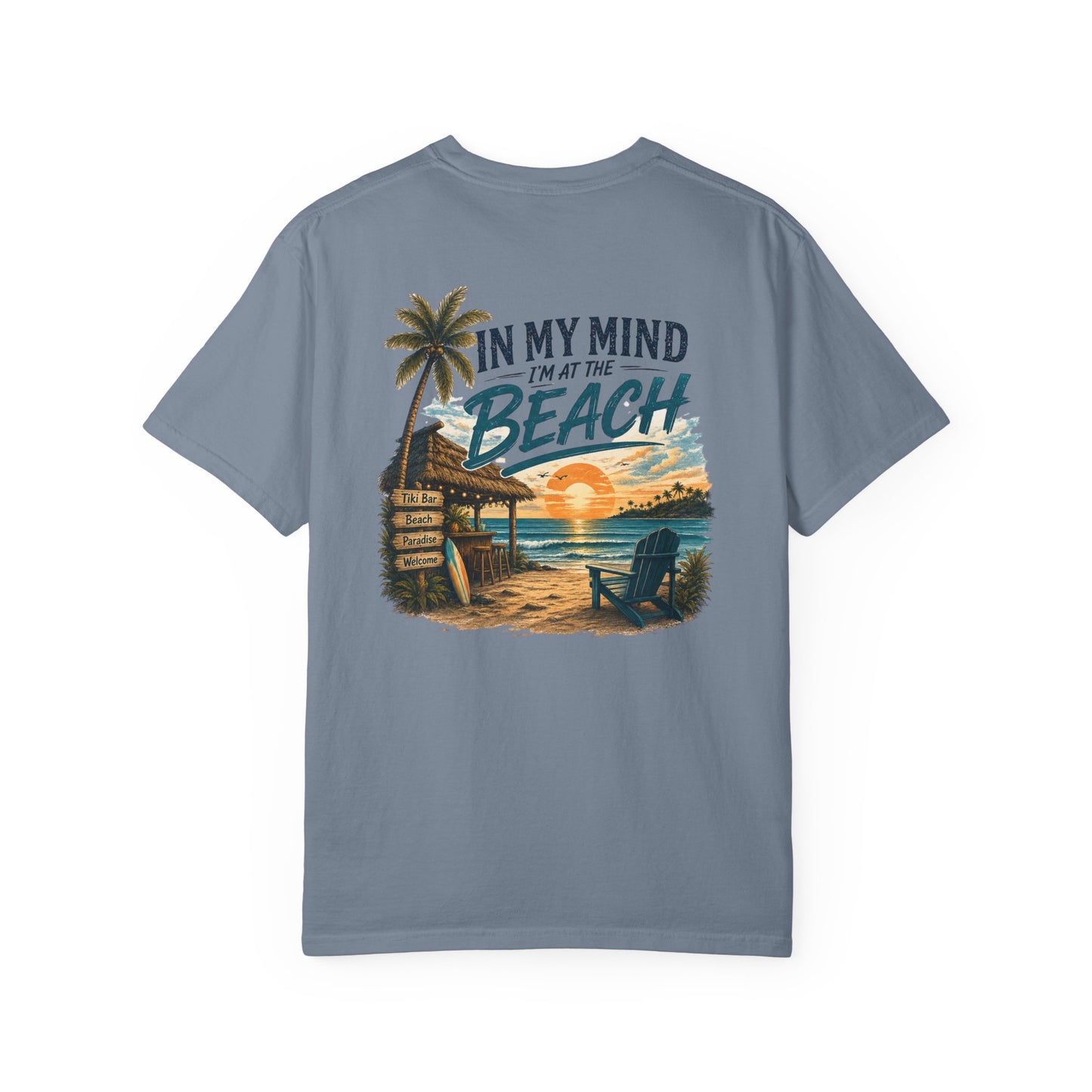 Blue t-shirt with beach graphic and text on a white background