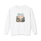 A white long-sleeve crewneck sweatshirt featuring a retro-style graphic on the chest with the text 'Beach DREAMS' and a vintage beach scene illustration.
