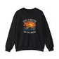 A black crewneck sweatshirt with a graphic print on the front showing a fishing boat at sunset with the text 'LIFE IS BETTER ON THE WATER' in a distressed cream font.