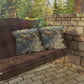 Wooden swing with patterned cushions on a stone patio