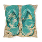Pillow with teal flip-flops on a sand-like surface