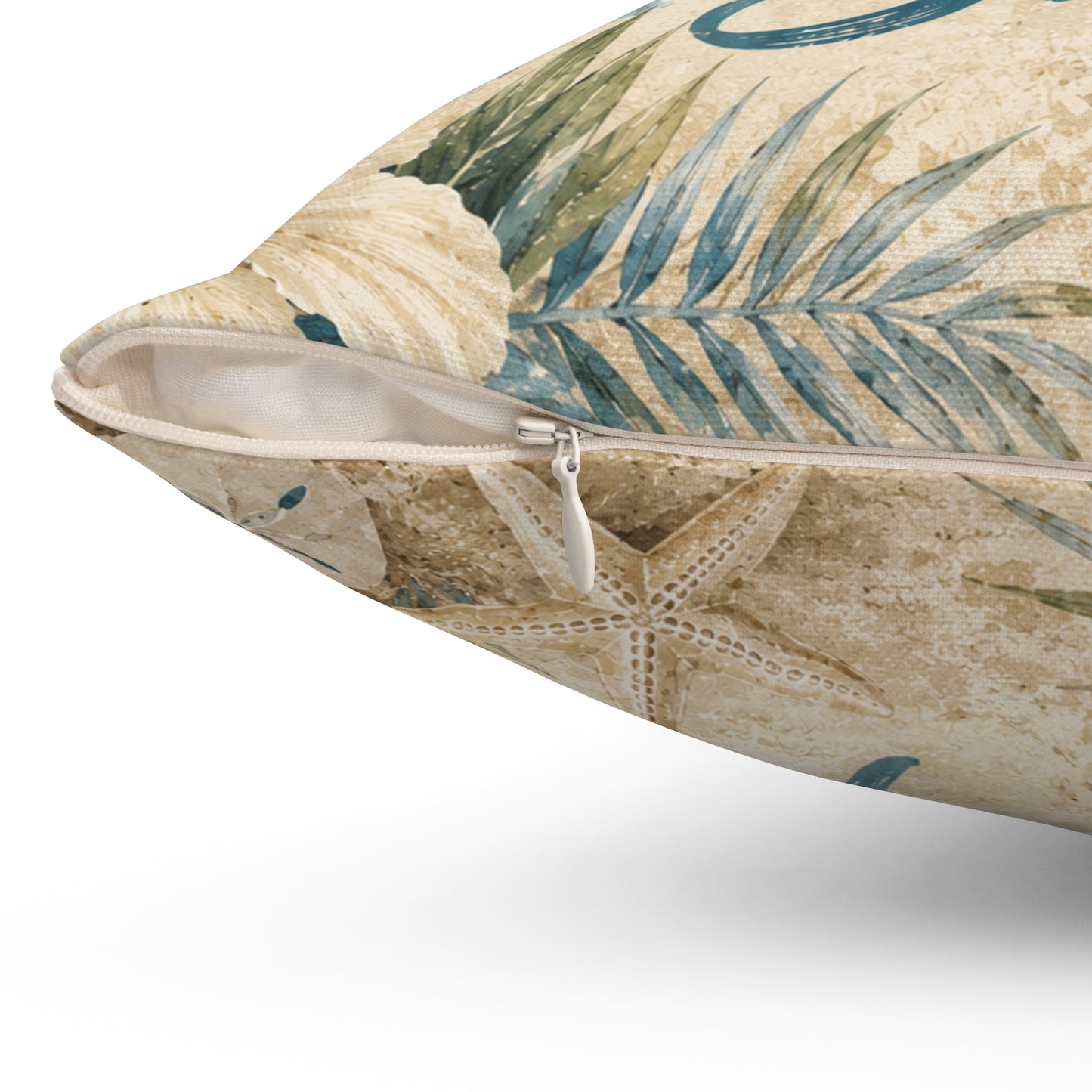 Square polyester pillow with tropical print and visible zipper along side seam