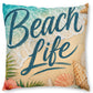 A square decorative throw pillow featuring a tropical beach design with the words 'Beach Life' in dark teal script over a sandy beige background, with turquoise ocean waves, palm leaves, and seashells around the border.