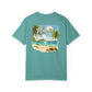 Teal t-shirt with a tropical beach graphic and 'Paradise' text on a white background