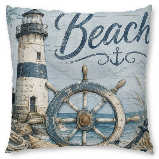 A square decorative throw pillow featuring a nautical design with a lighthouse, a large ship's wheel, rope details, and the word 'Beach' in script on a light blue background.