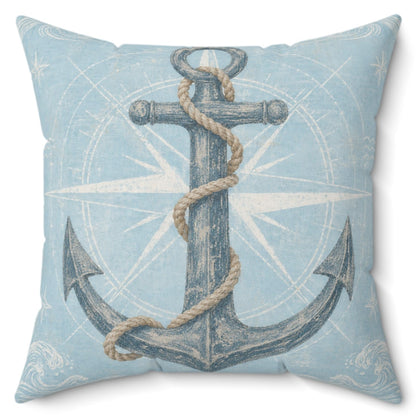 A square throw pillow featuring a vintage-style nautical print with a dark blue anchor wrapped in beige rope over a light blue compass rose background.