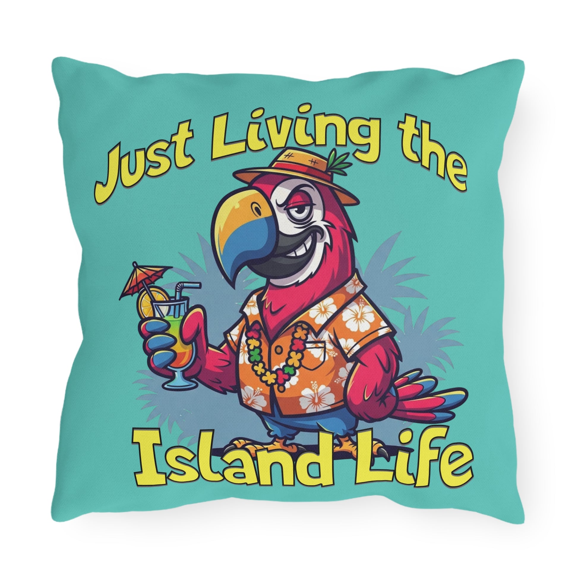 Decorative pillow with a parrot holding a cocktail and text 'Just Living the Island Life' on a teal background.