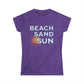 Purple t-shirt with 'Beach Sand Sun' text and sun graphic on a white background