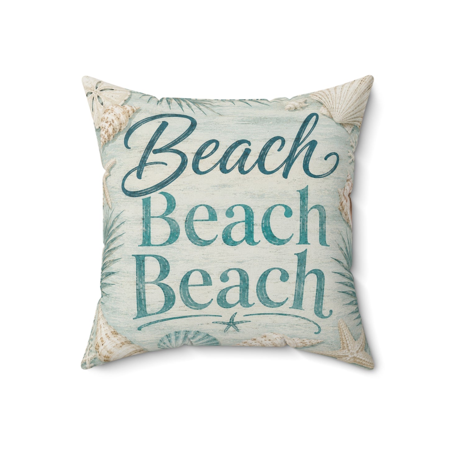 A square decorative throw pillow featuring the phrase 'Beach Beach Beach' in teal script and block lettering, surrounded by a seashell and palm leaf pattern on a light blue and beige background.