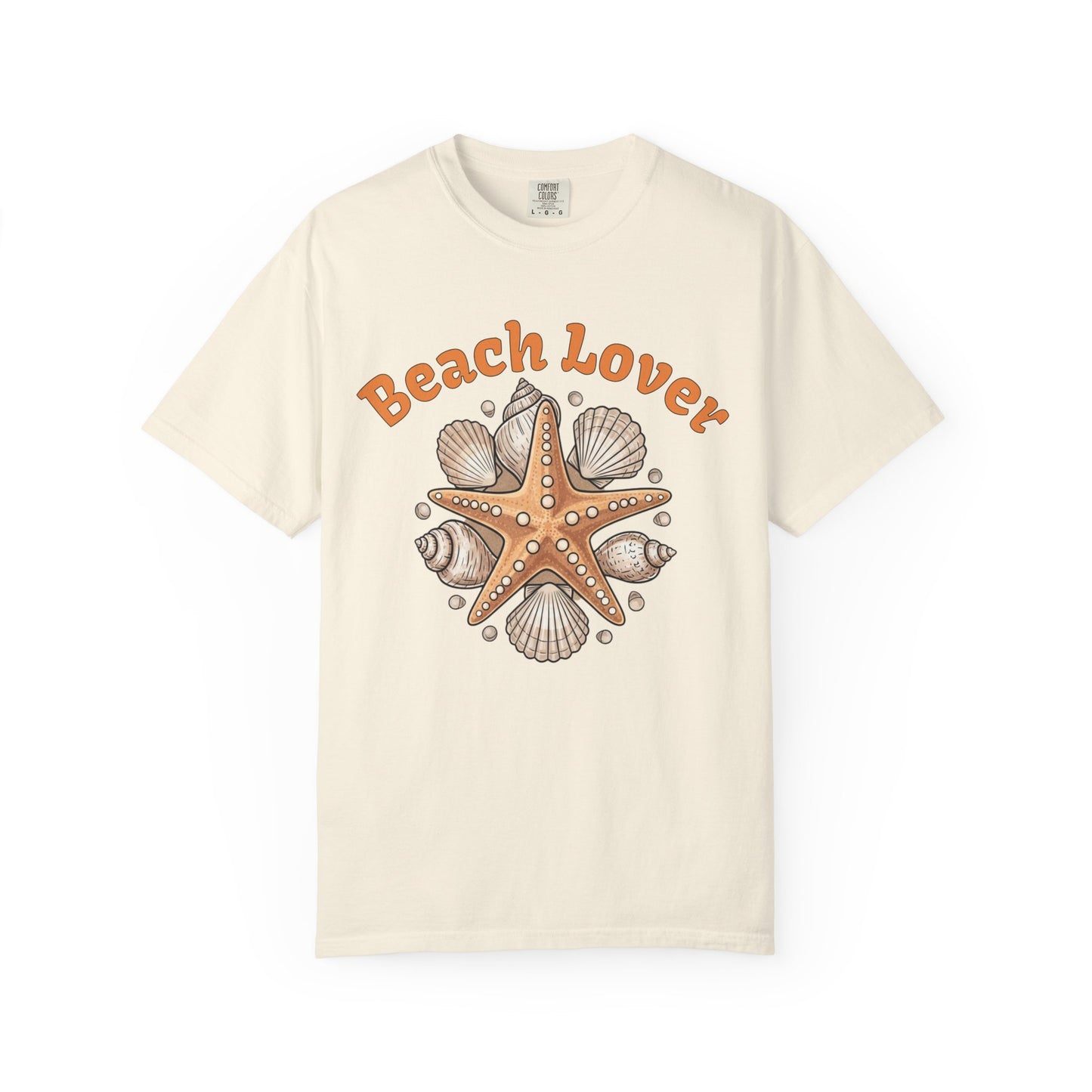 Beach Lover t-shirt with starfish and shell design on a beige background