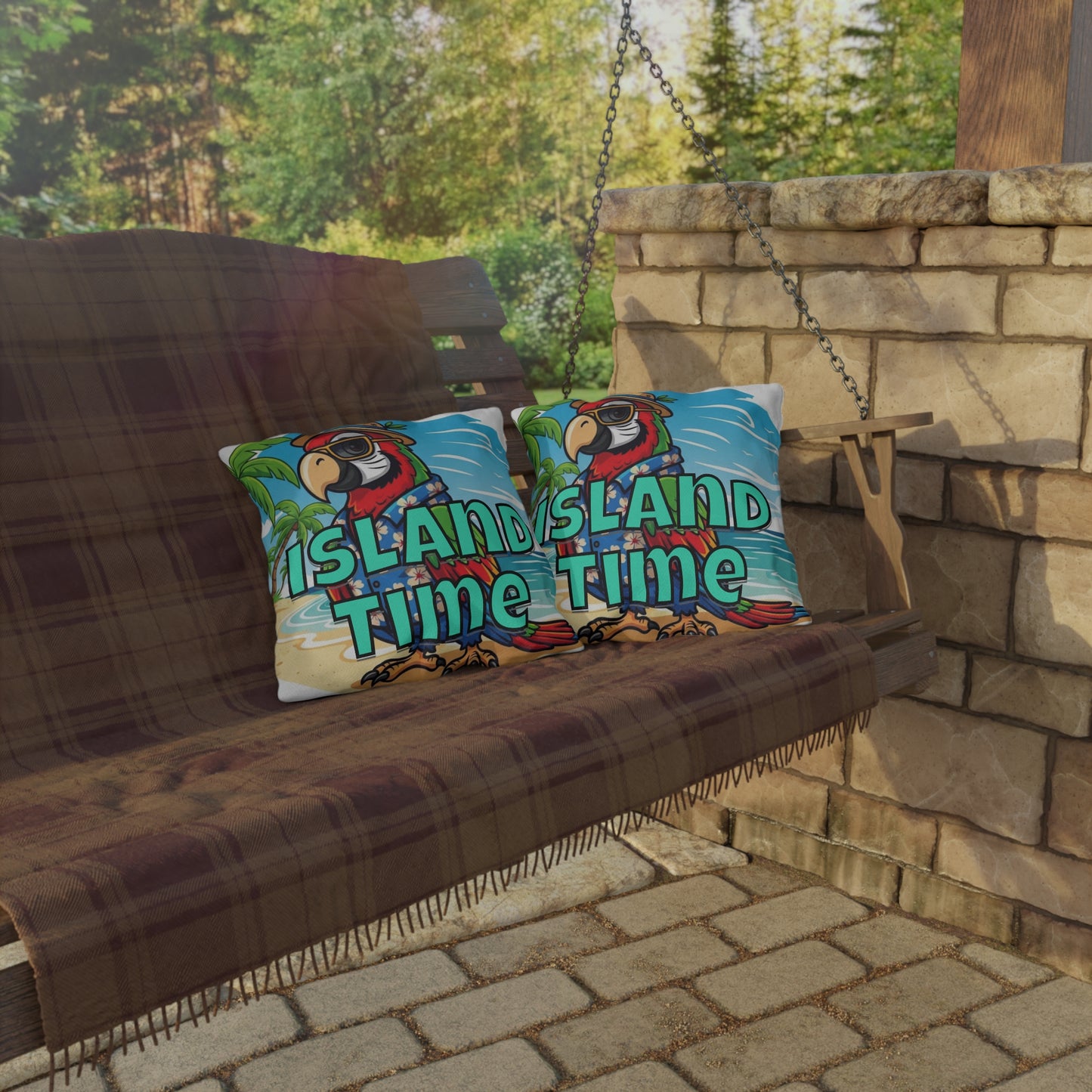 Two pillows with 'Island Time' text on a wooden swing against a stone wall and greenery background.