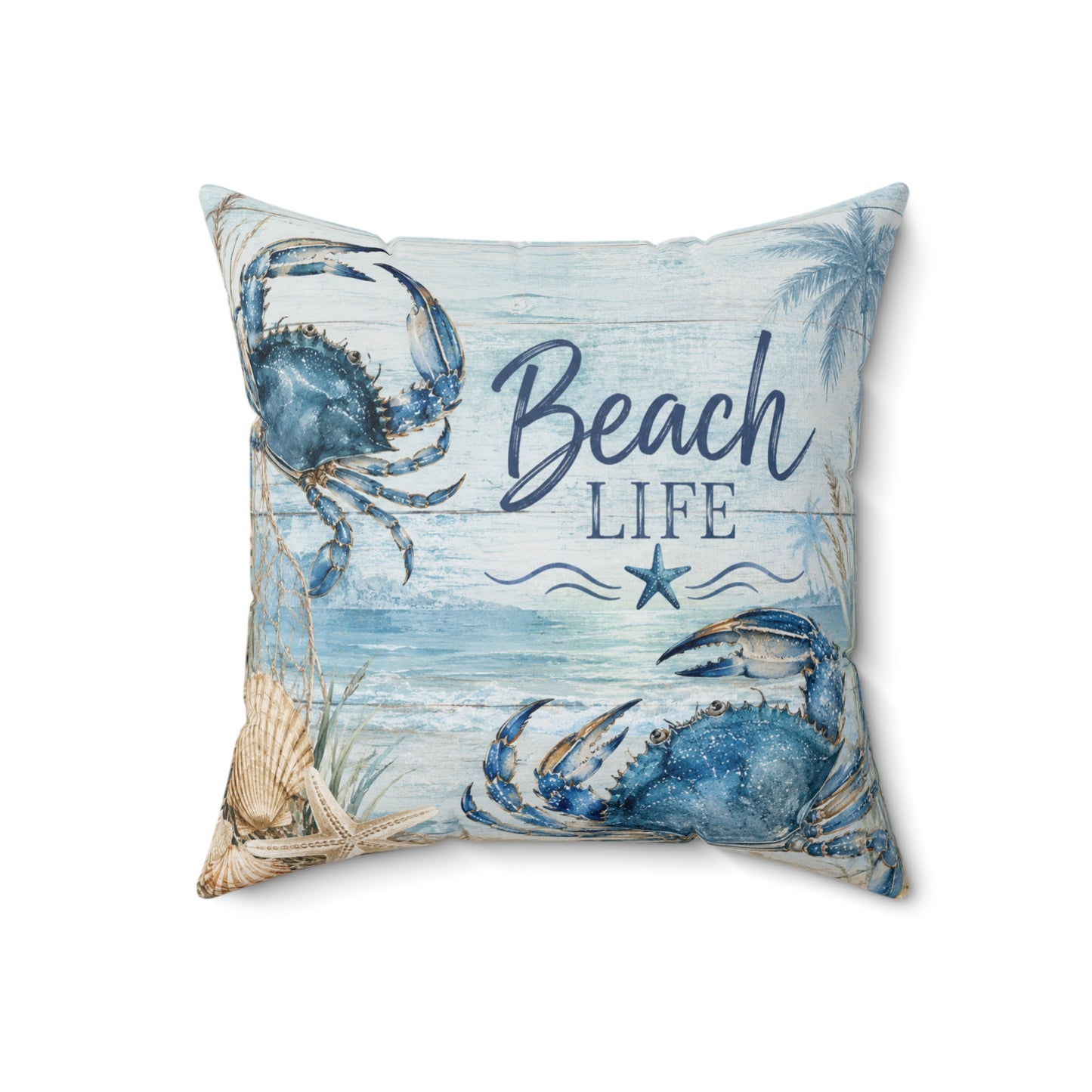A square decorative throw pillow with a beach-themed print featuring blue crabs, a starfish, palm trees, and the words 'Beach Life' in navy script and block lettering on a light blue and white background.