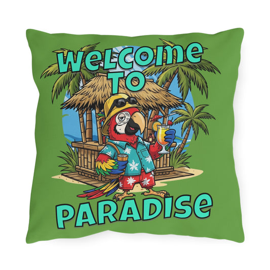 Pillow with a tropical design featuring a parrot and 'Welcome to Paradise' text on a green background.