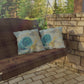 Wooden swing with decorative pillows in a garden setting