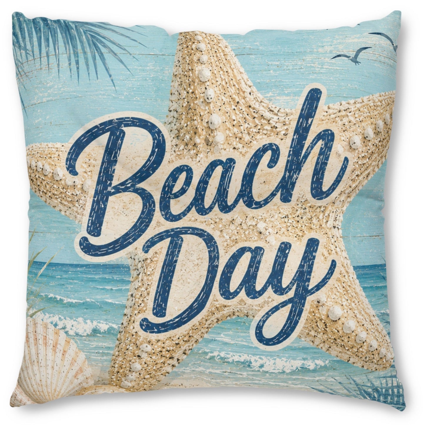 Square beach-themed throw pillow featuring a large beige starfish over a light blue ocean background with the words “Beach Day” in dark blue script, plus seashell and palm leaf details.