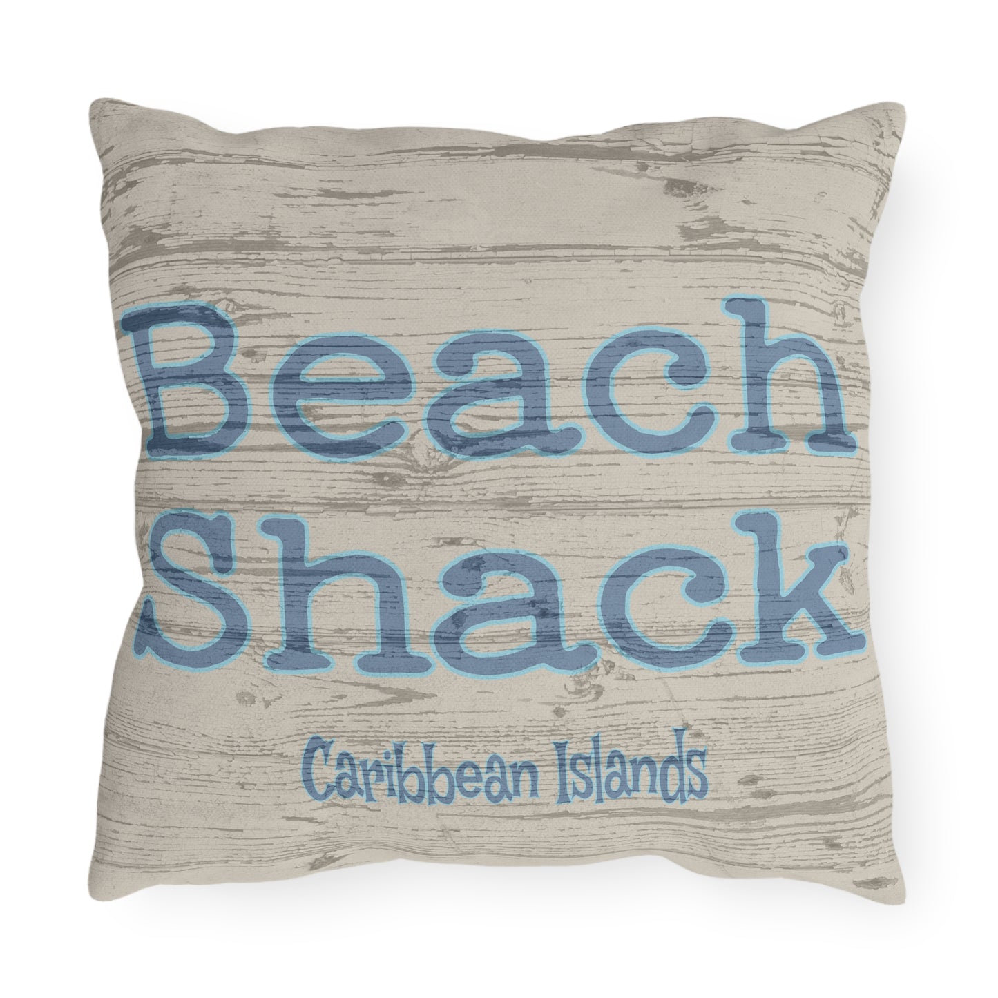 Pillow with 'Beach Shack Caribbean Islands' text on a textured background