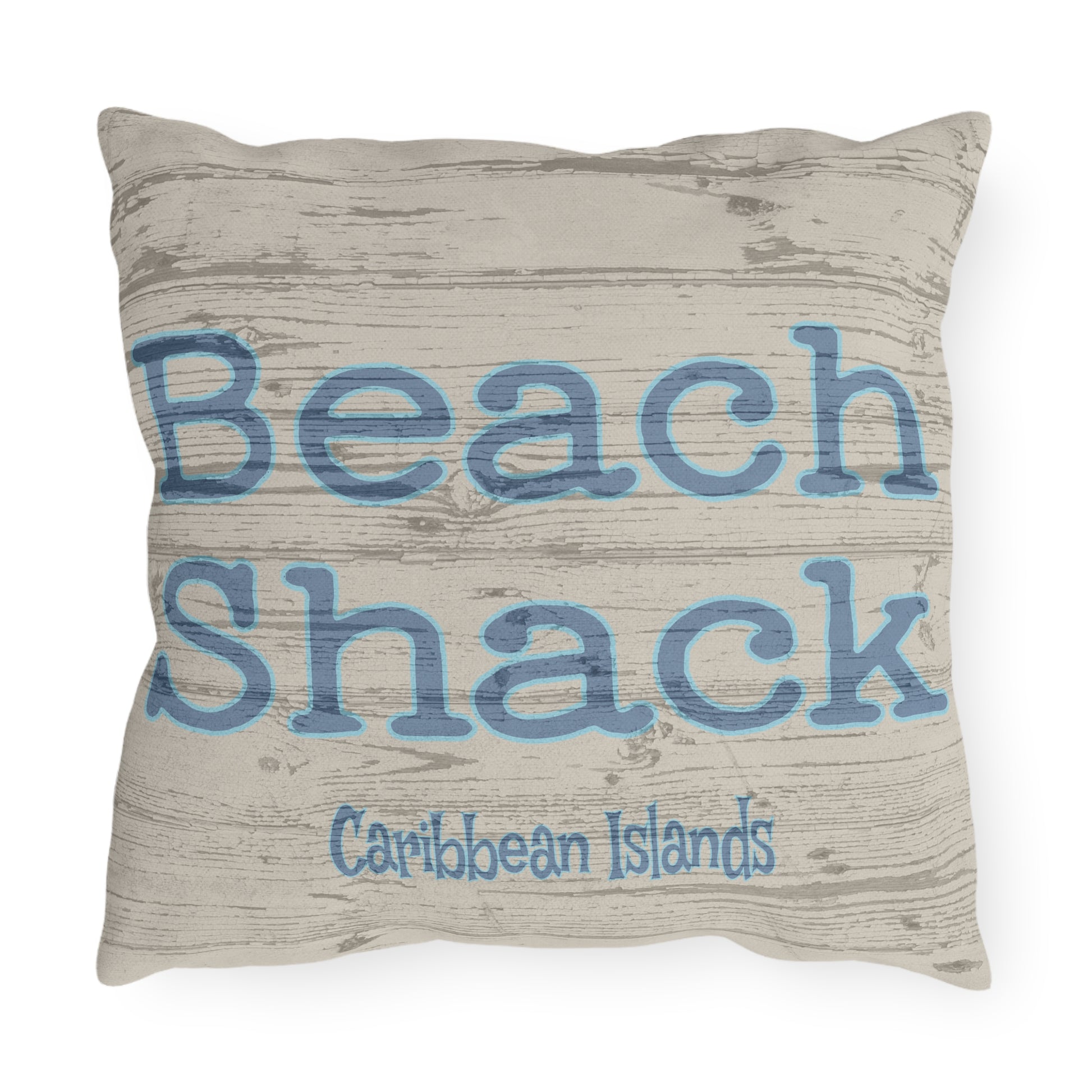 Pillow with 'Beach Shack Caribbean Islands' text on a textured background