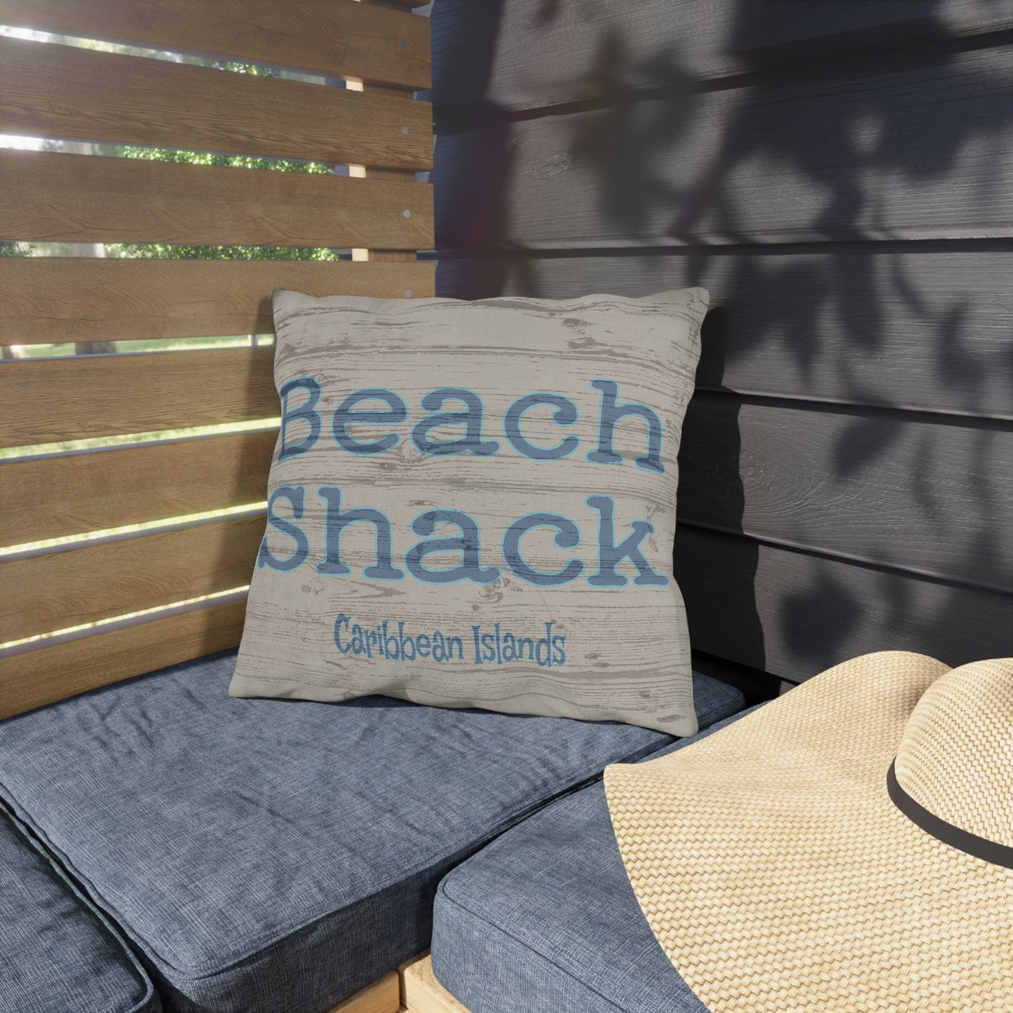 Pillow with 'Beach Shack Caribbean Islands' text on a wooden bench