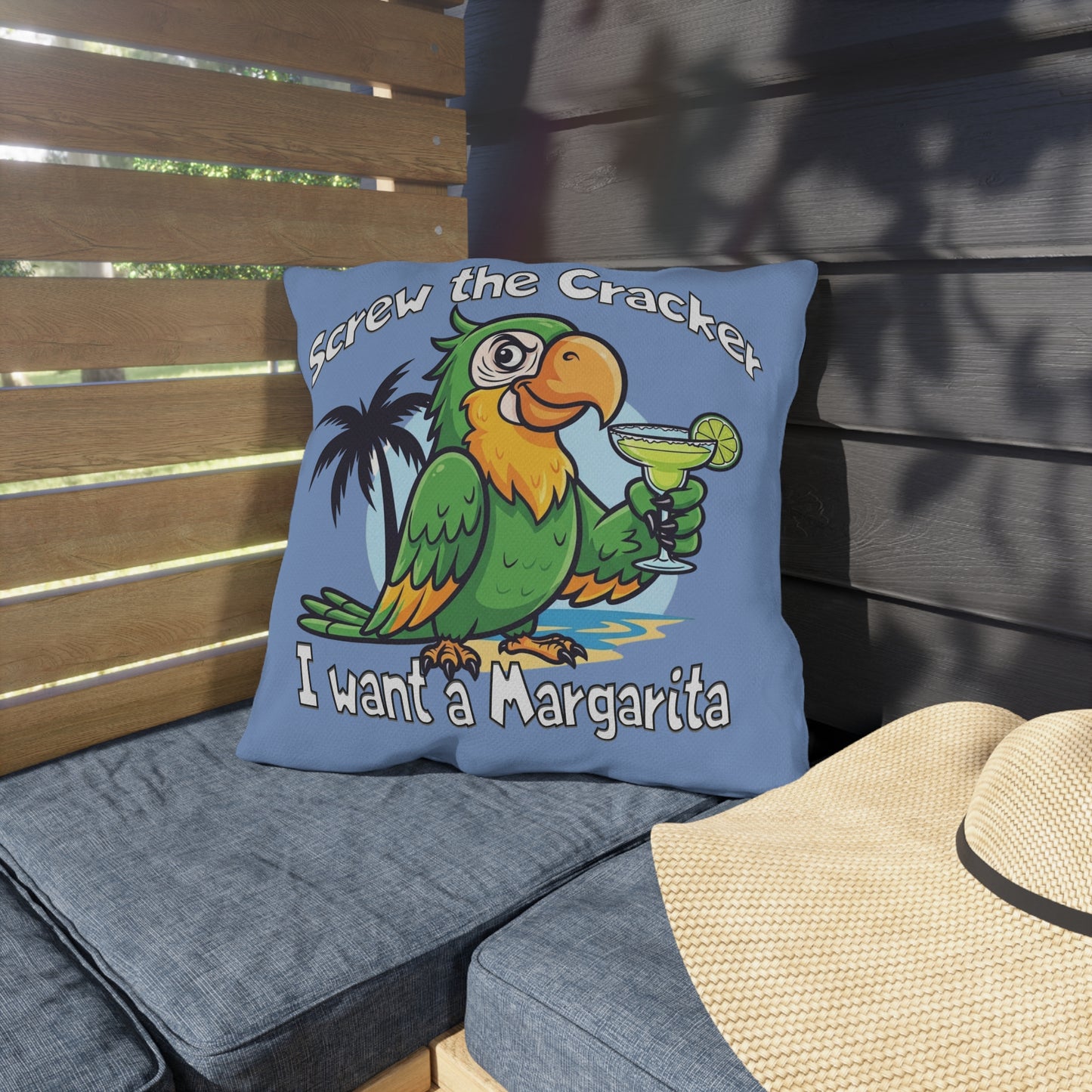 Blue pillow with a parrot graphic and text on a wooden bench