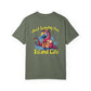 Green t-shirt with a colorful parrot graphic and 'Just Living the Island Life' text on a white background