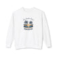 A white crewneck sweatshirt with a tropical beach graphic on the chest featuring palm trees, a sunset, and the text 'Just Another Day in PARADISE'.