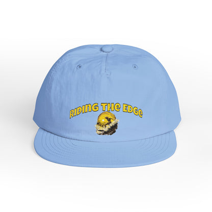 Light blue cap with 'Riding the Edge' text and graphic on a white background