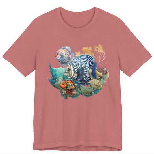 Pink t-shirt with a colorful fish and coral design on a white background by Caribbean Rays