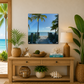 Nautical-themed decor with a wooden console table, plants, and a beach scene painting.
