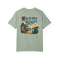 Light green t-shirt with beach graphic and text on a white background