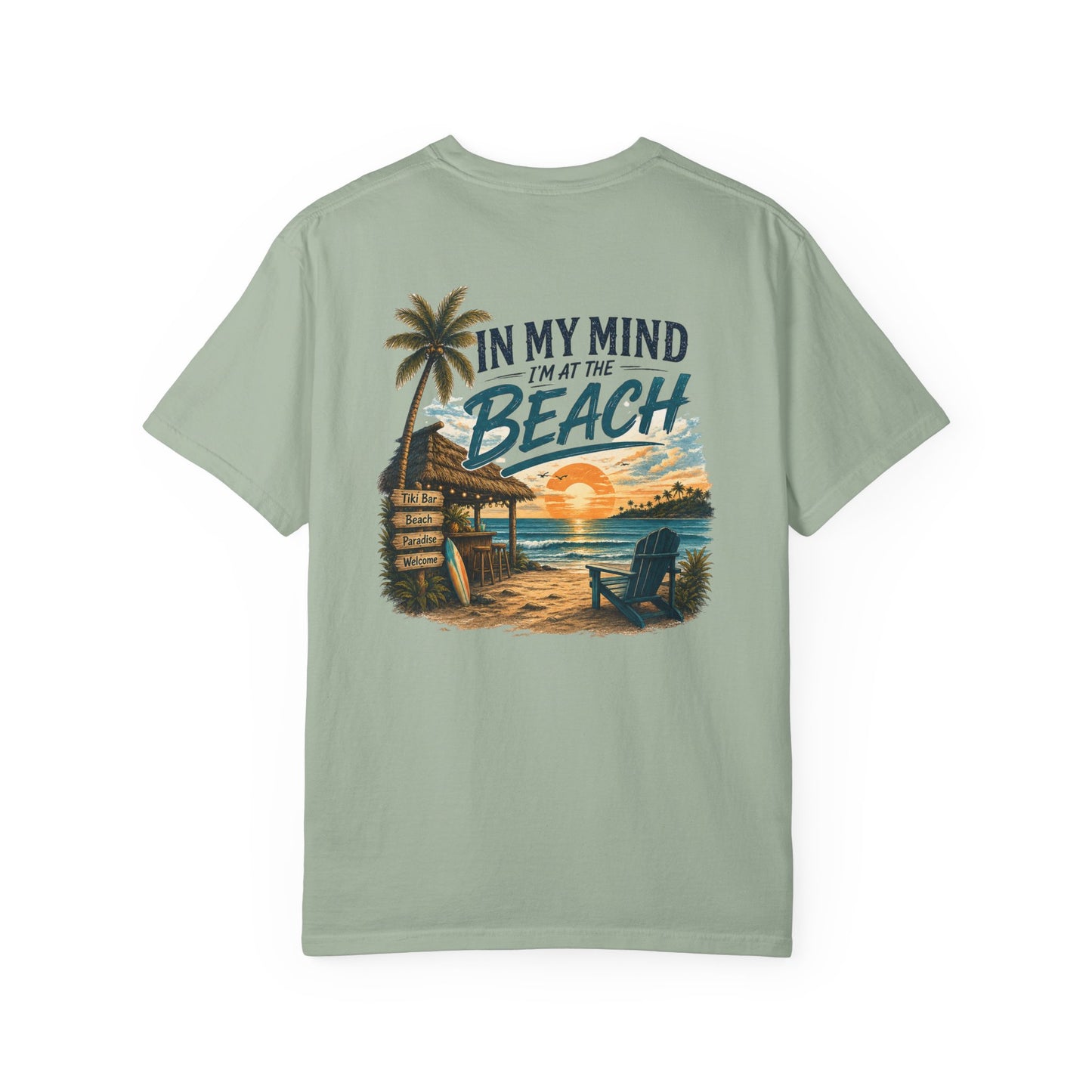 Light green t-shirt with beach graphic and text on a white background
