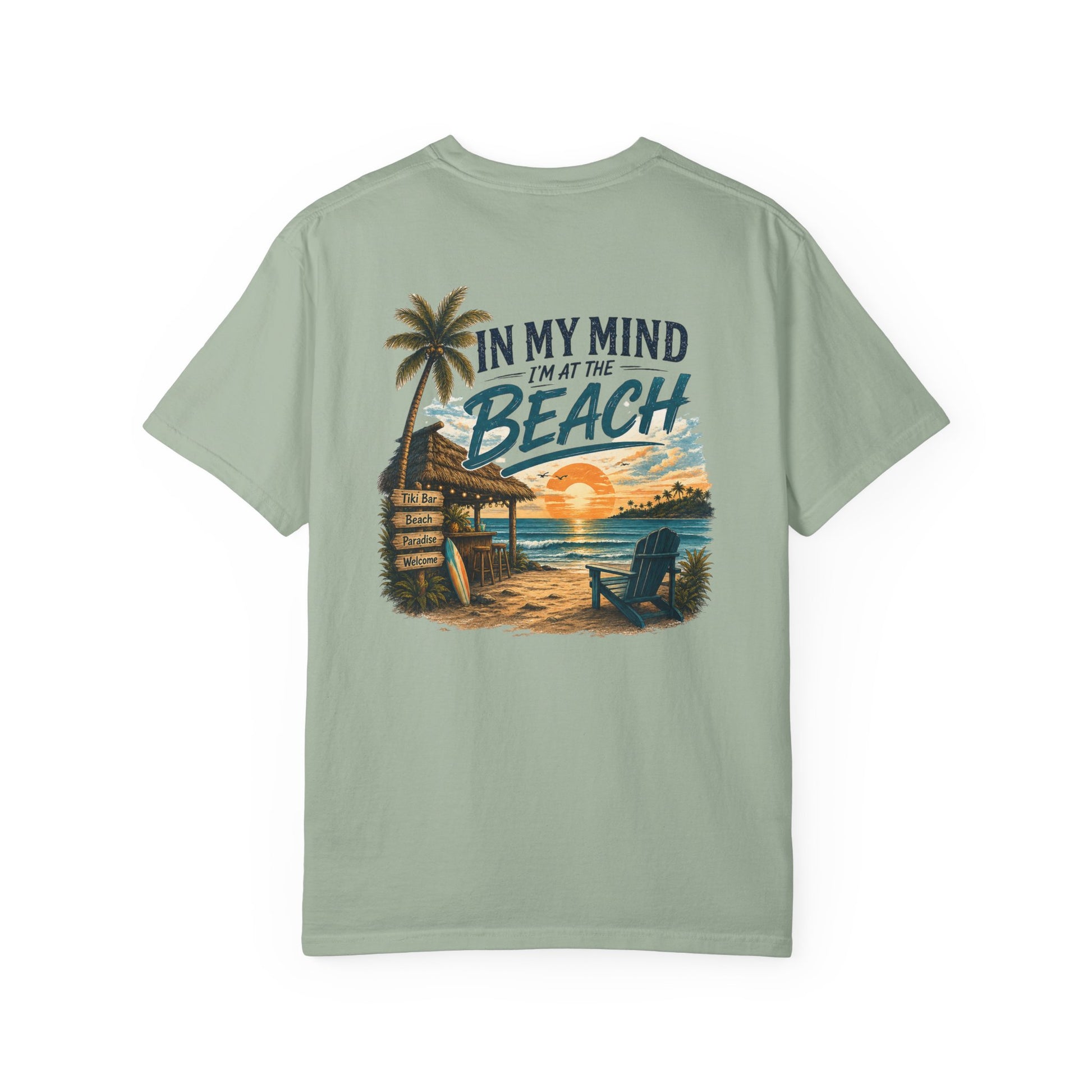 Light green t-shirt with beach graphic and text on a white background