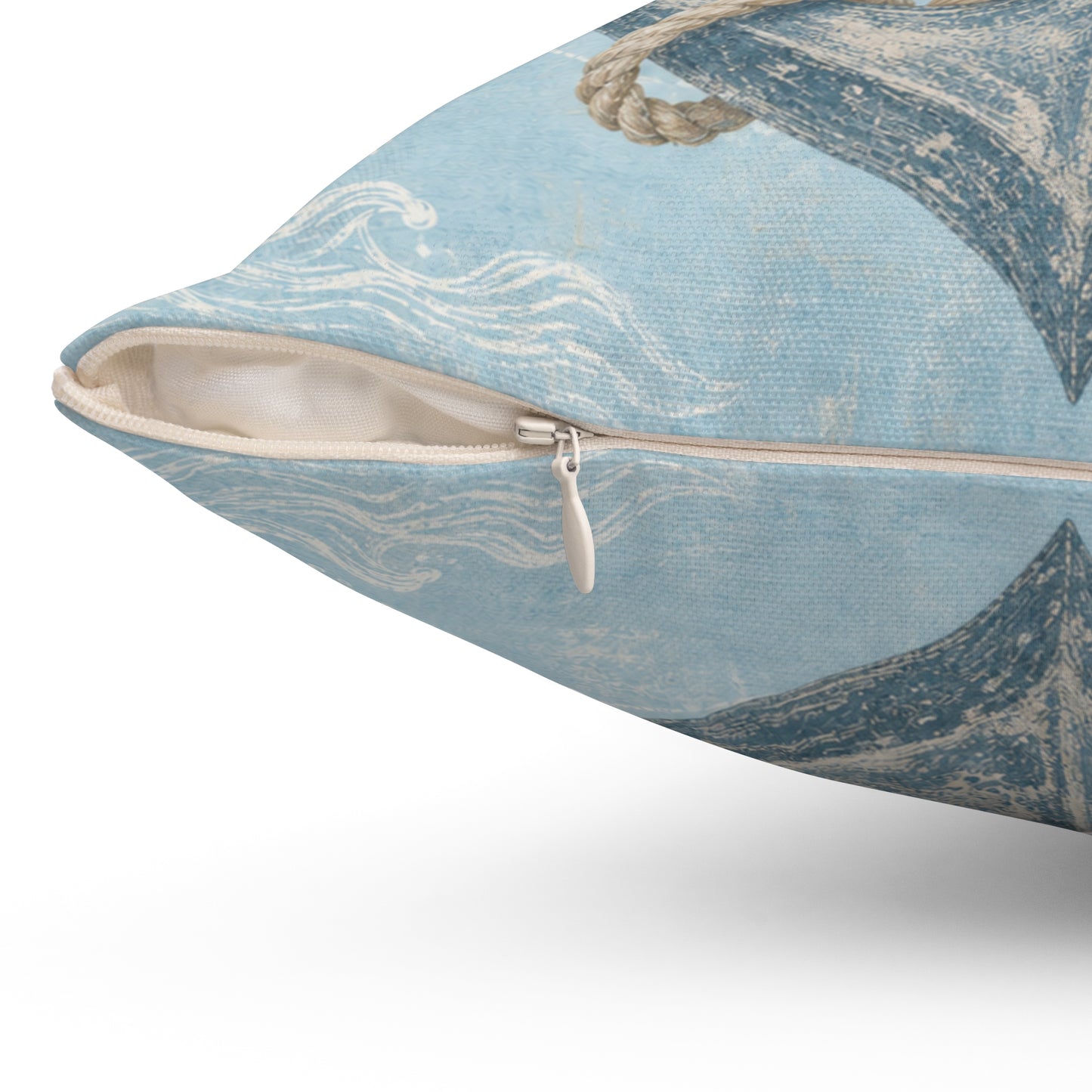 Light blue square pillow, side view with zipper pull and beige inner panel