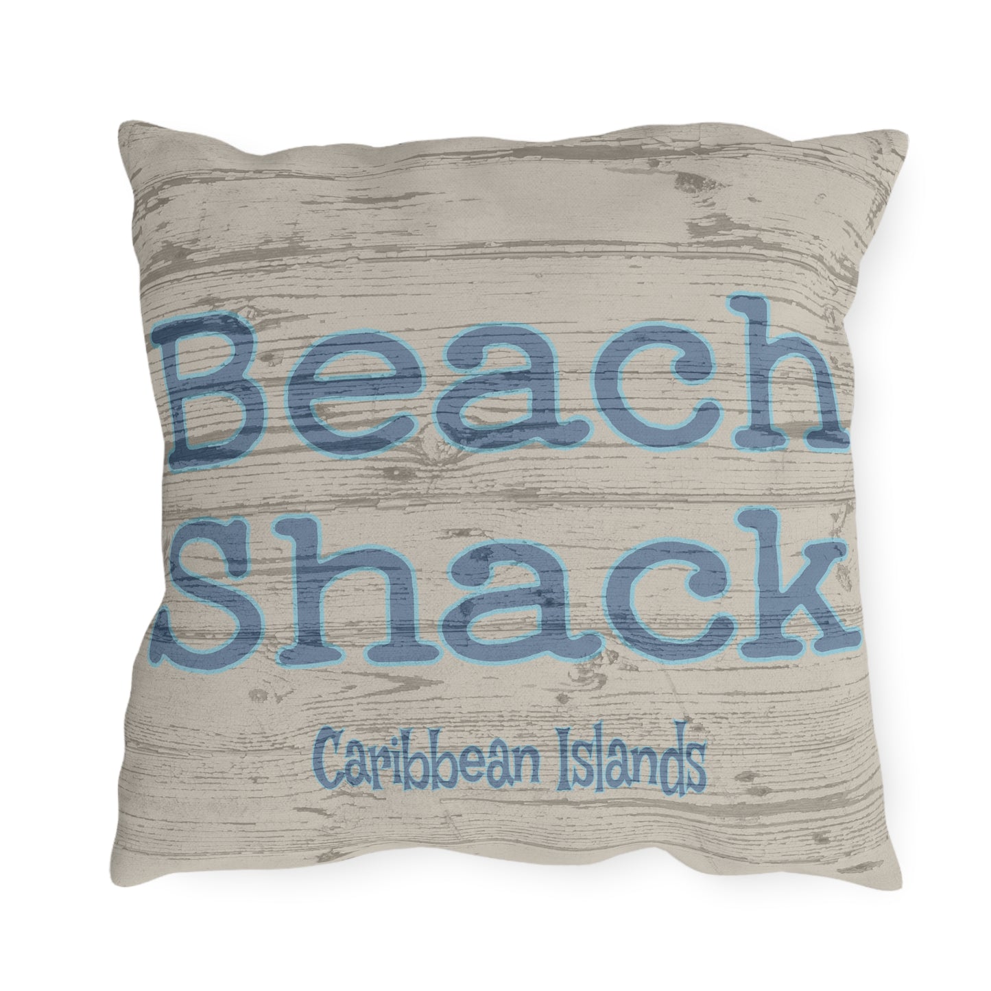 Pillow with 'Beach Shack Caribbean Islands' text on a textured background
